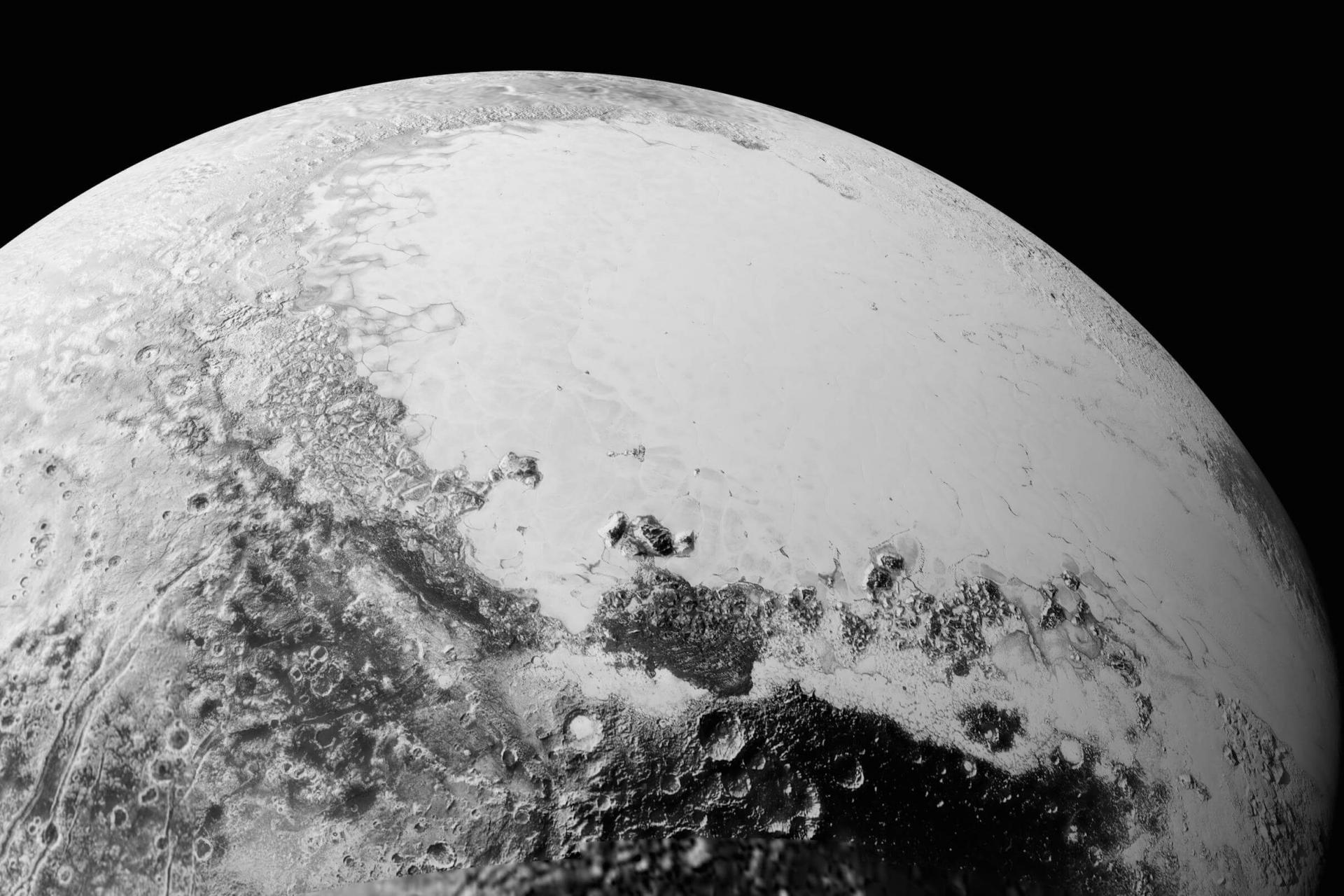 Close up view of Pluto&#039;s large heart-shaped glacier and mountains of ice.