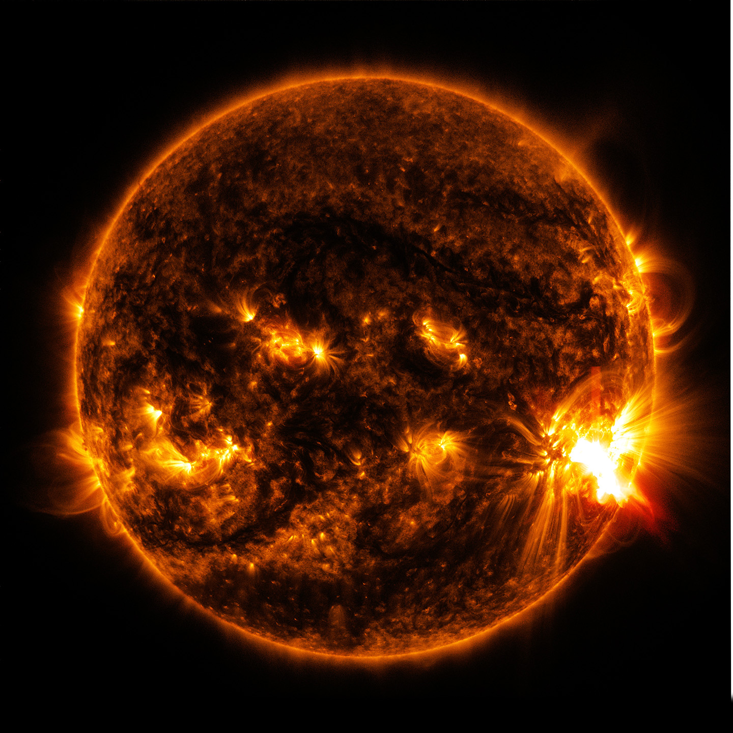 X2.0-class solar flare bursting off the lower right side of the Sun