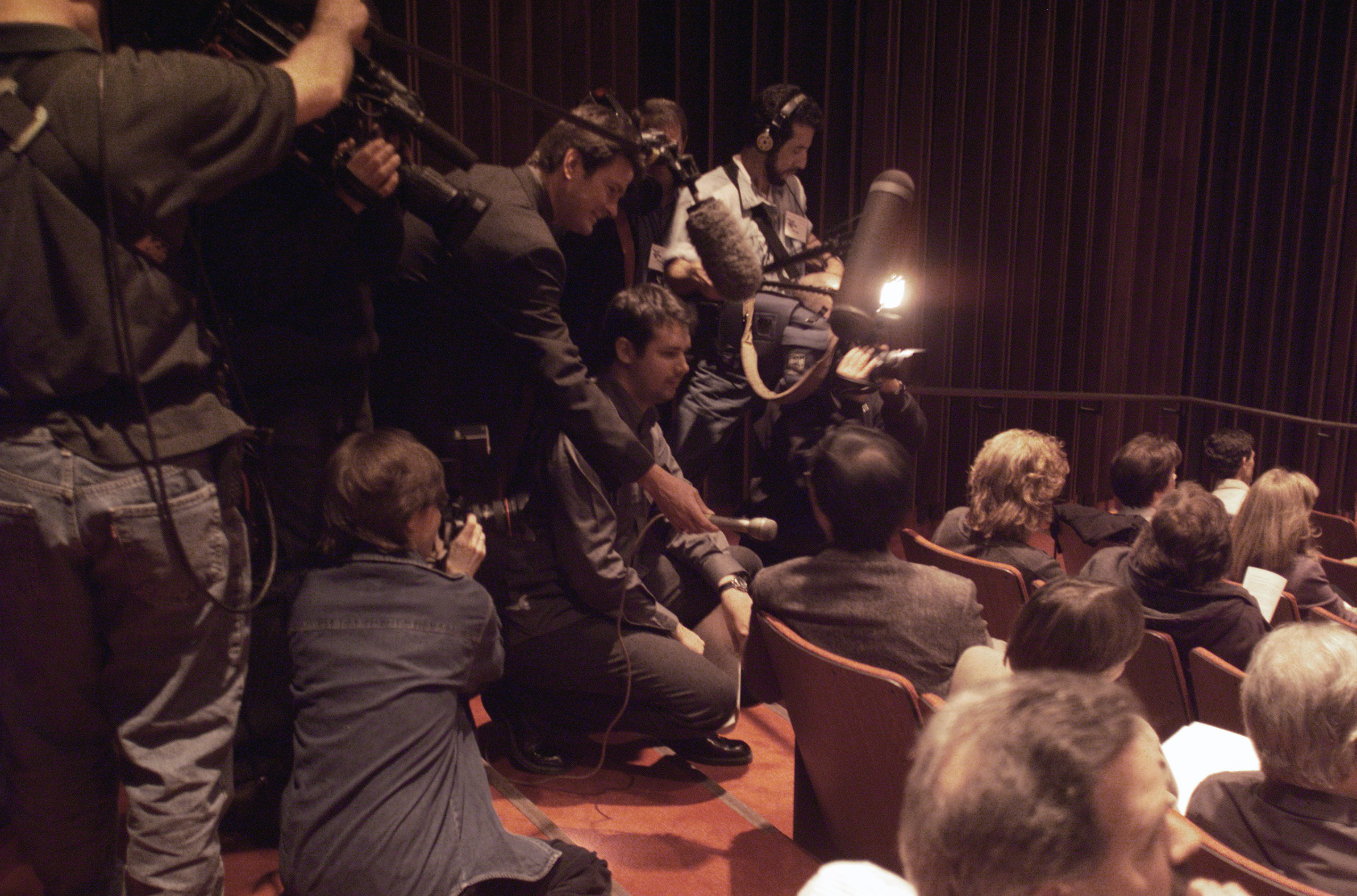 Image from 2001 of reporters asking seated Andy Cheng about NEAR