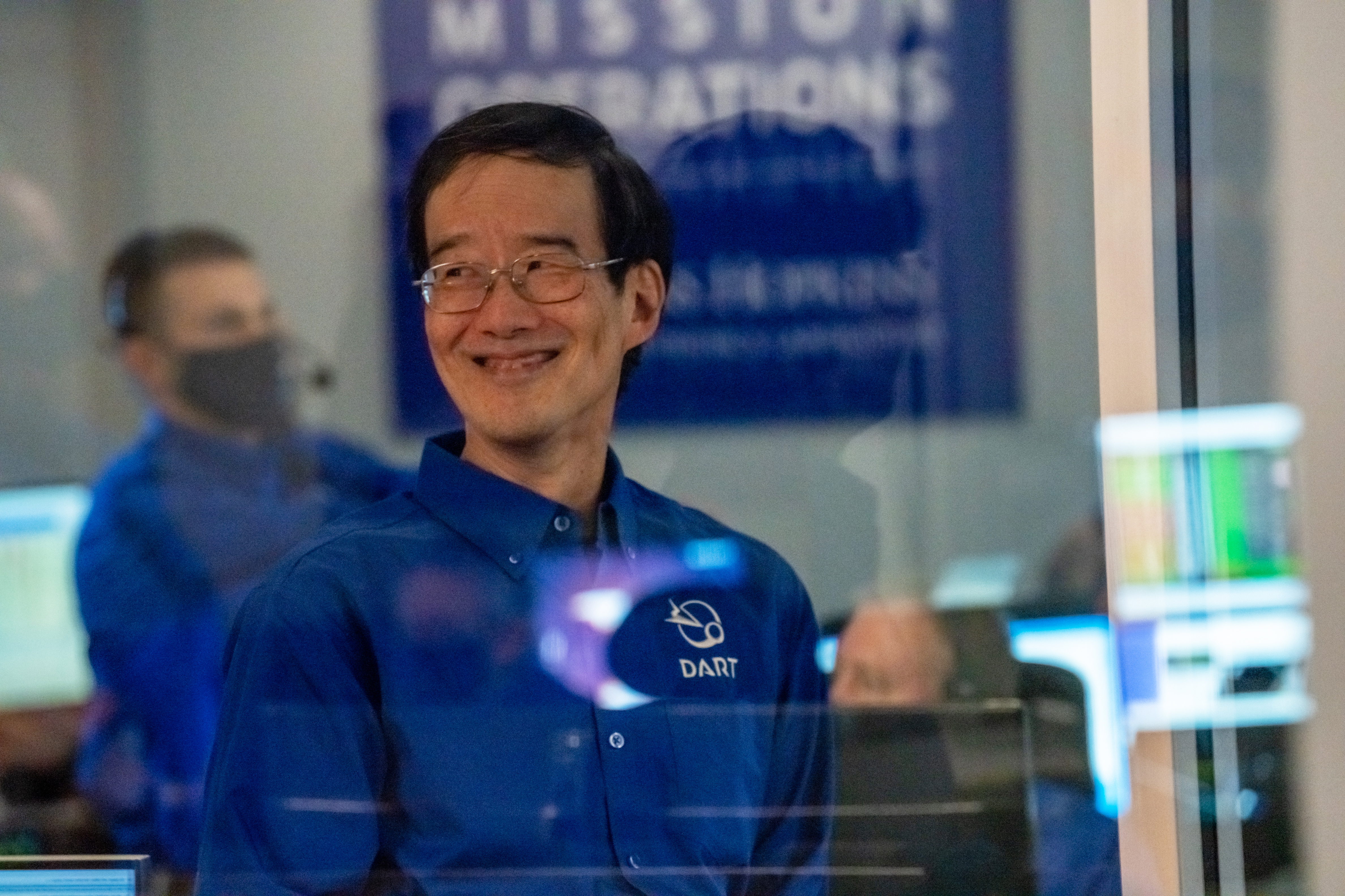 Andy Cheng wearing his blue DART shirt smiles after DART's launch