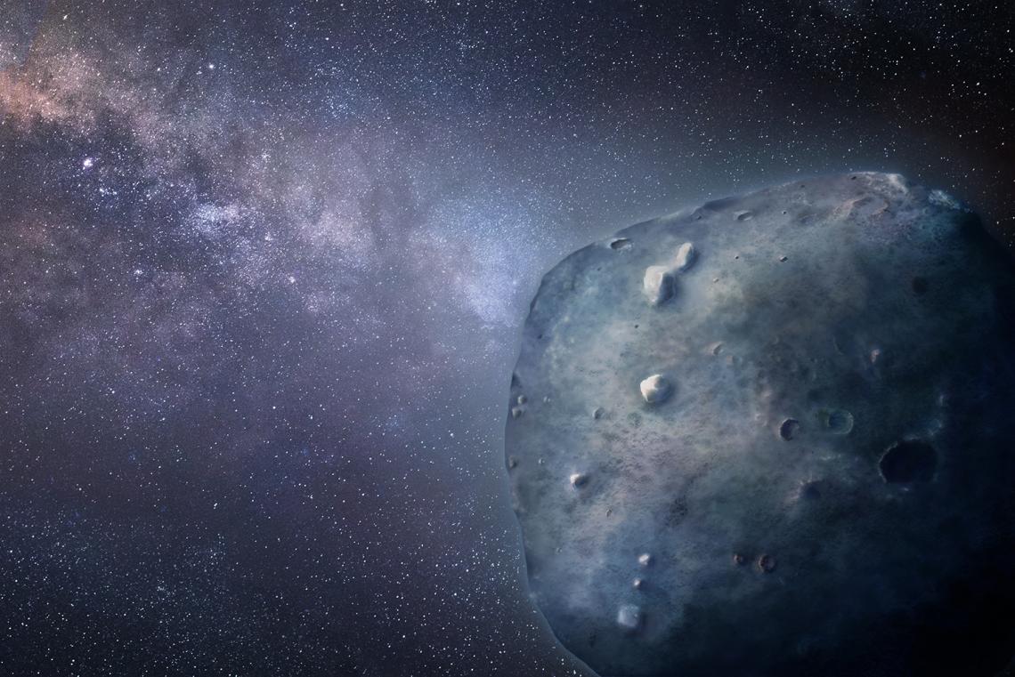 Illustration of the blue asteroid Phaethon in space with parts of the Milky Way galaxy in the background