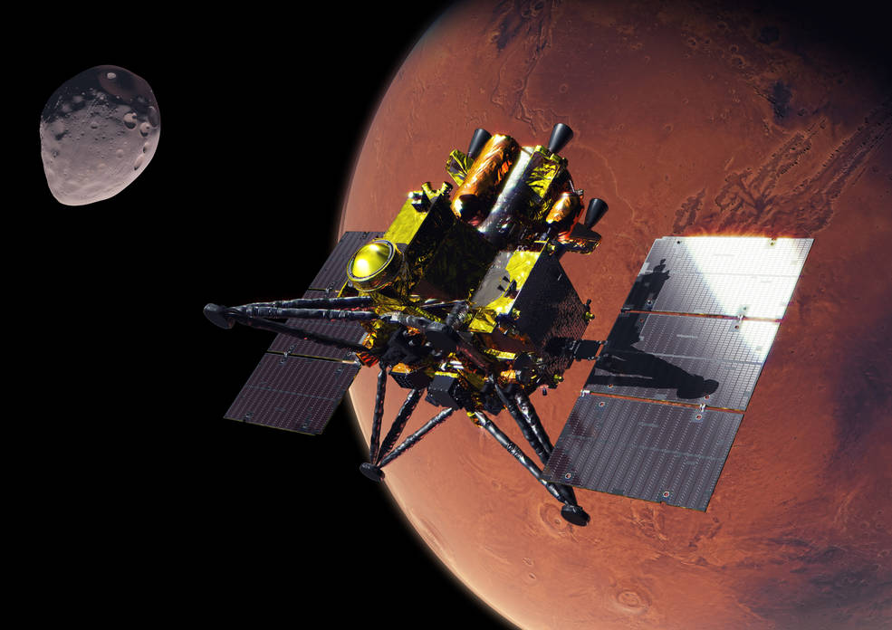 A spacecraft flies in space with the red Mars behind it and the small asteroid moon Phobos off to the top left