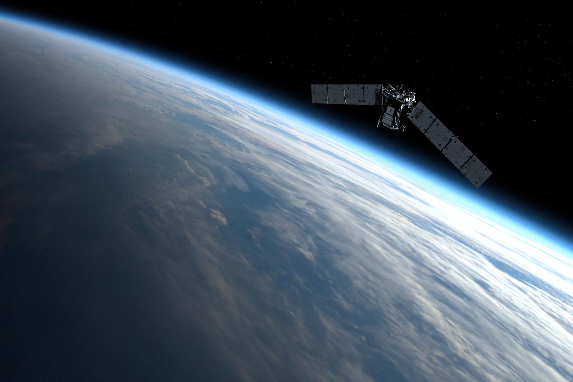 A spacecraft orbits high above the blue and cloud-covered Earth
